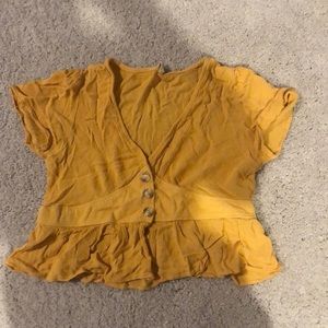yellow cropped shirt